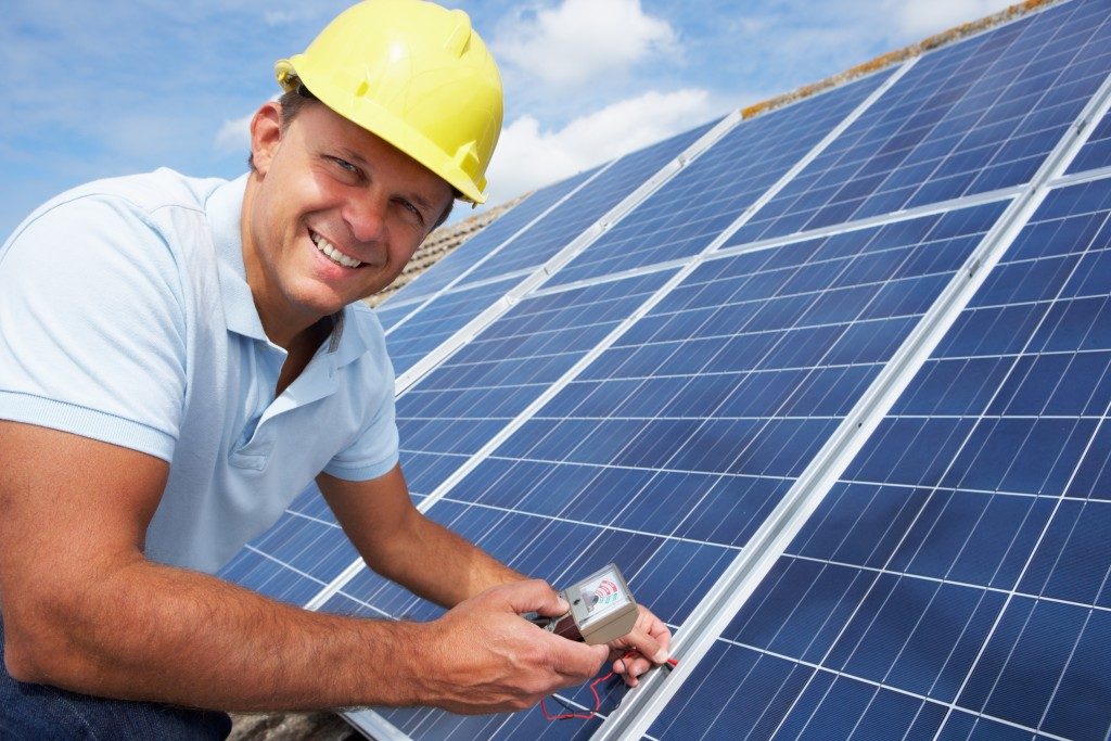 engineer checking solar panels