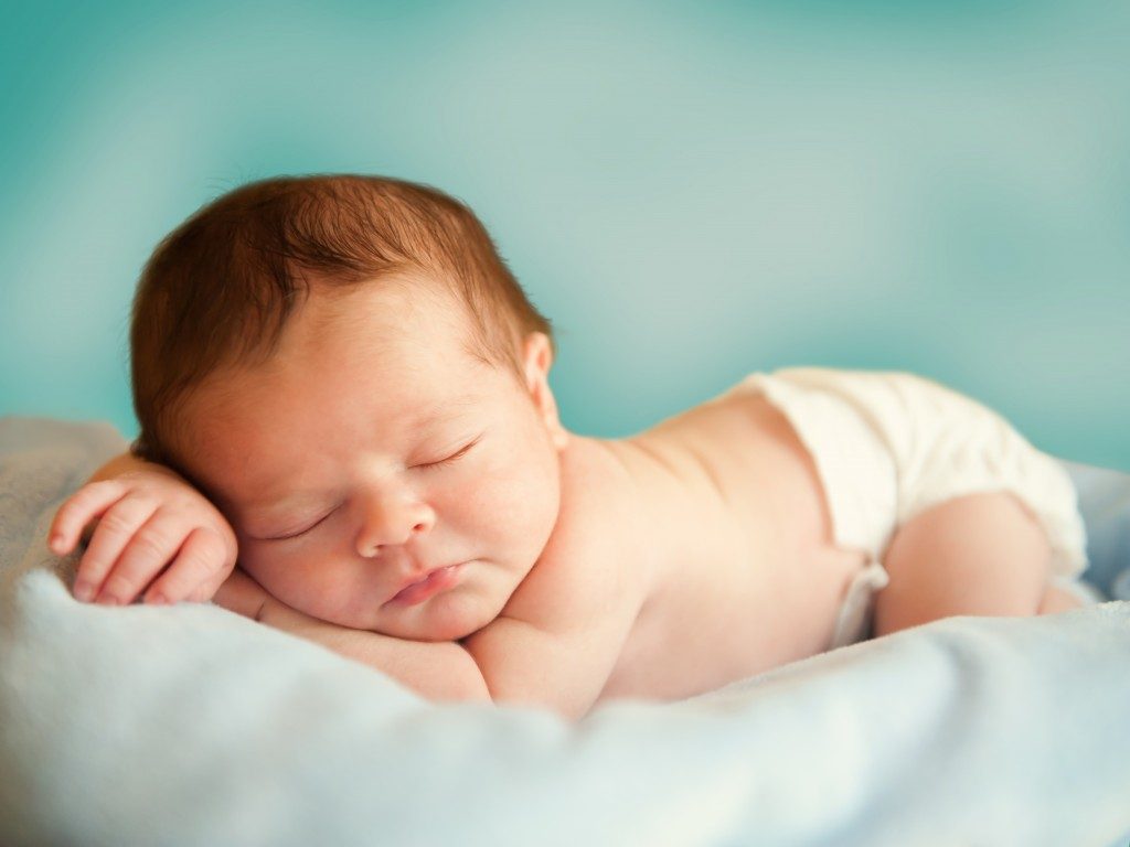 Little newborn baby boy 14 days, sleeps