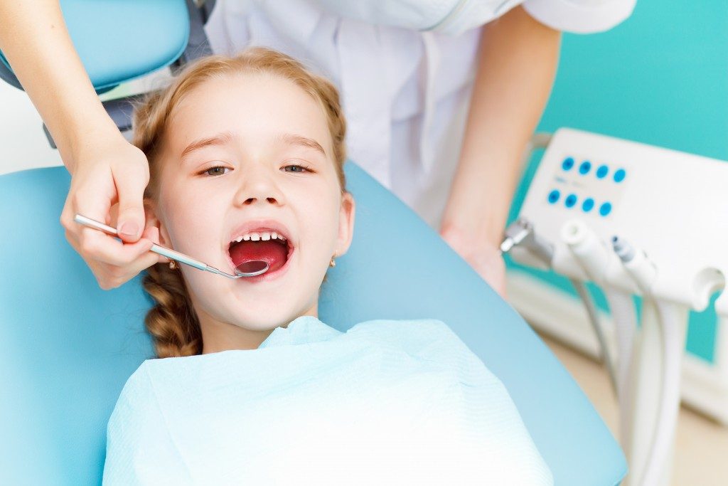 child with the dentist