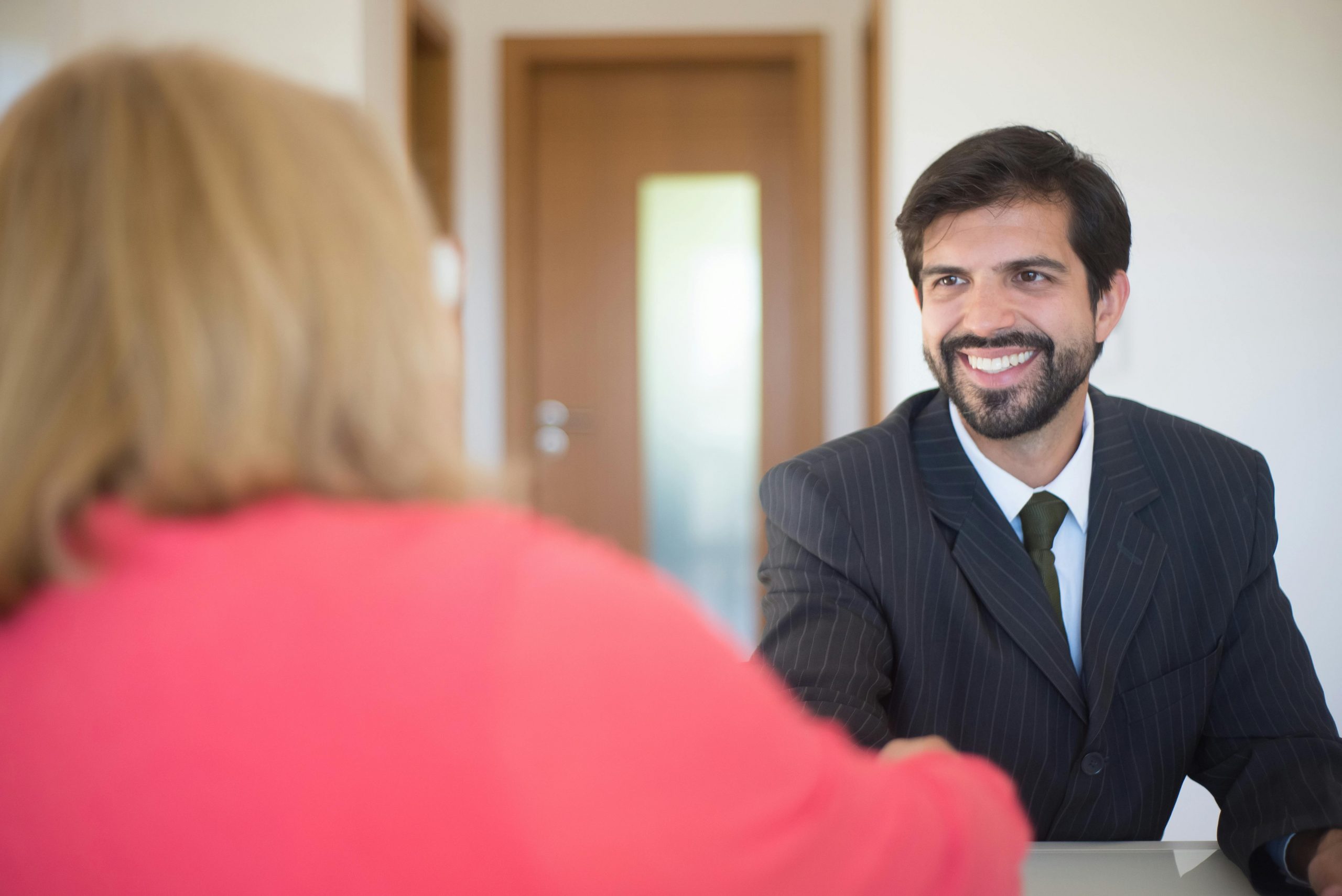 smiling man in business attire during a job interview
